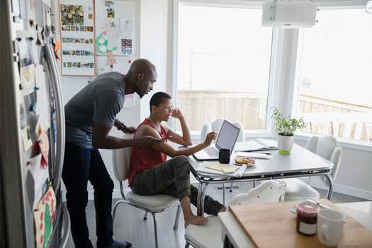 man and women on a laptop